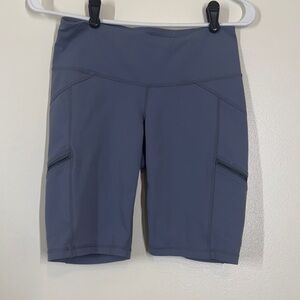 Athleta Women's gray/blue Bike Shorts Small with zipper pockets on thigh EUC